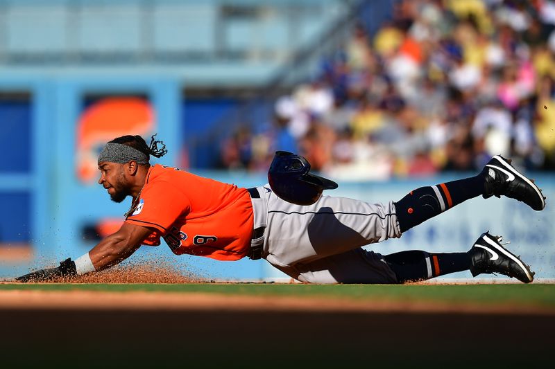 Jun 25, 2023; Los Angeles, California, USA; Houston Astros designated hitter Corey Julks (9) steals second against the Los Angeles Dodgers during the seventh inning at Dodger Stadium. Mandatory Credit: Gary A. Vasquez-USA TODAY Sports