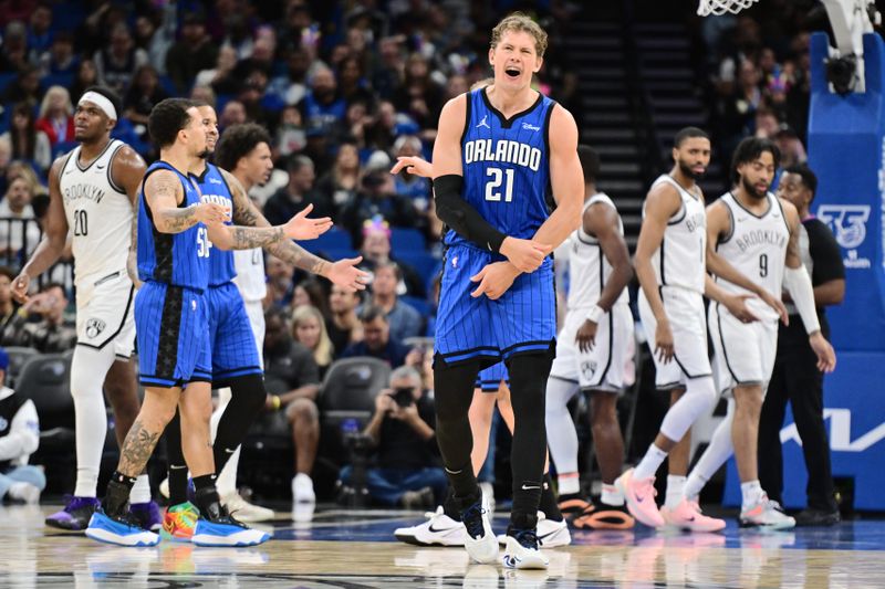 ORLANDO, FLORIDA - FEBRUARY 27: Moritz Wagner #21 of the Orlando Magic reacts to a foul in the second half of a game against the Brooklyn Nets at Kia Center on February 27, 2024 in Orlando, Florida. NOTE TO USER: User expressly acknowledges and agrees that, by downloading and or using this photograph, User is consenting to the terms and conditions of the Getty Images License Agreement. (Photo by Julio Aguilar/Getty Images)