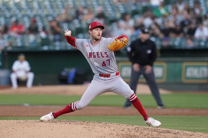 Jul 19, 2024; Oakland, California, USA; Los Angeles Angels pitcher Griffin Canning (47) delivers a pitch against the Oakland Athletics in the third inning at Oakland-Alameda County Coliseum. Mandatory Credit: Cary Edmondson-USA TODAY Sports