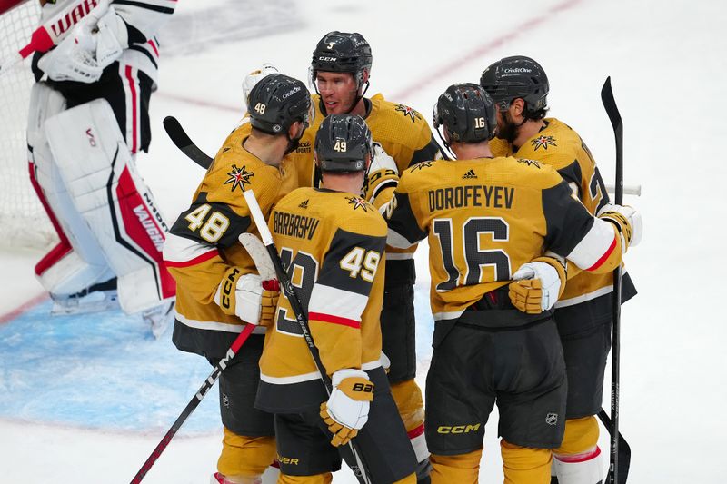 Apr 16, 2024; Las Vegas, Nevada, USA; Vegas Golden Knights defenseman Brayden McNabb (3) celebrates with teammates after scoring a goal against the Chicago Blackhawks during the second period at T-Mobile Arena. Mandatory Credit: Stephen R. Sylvanie-USA TODAY Sports