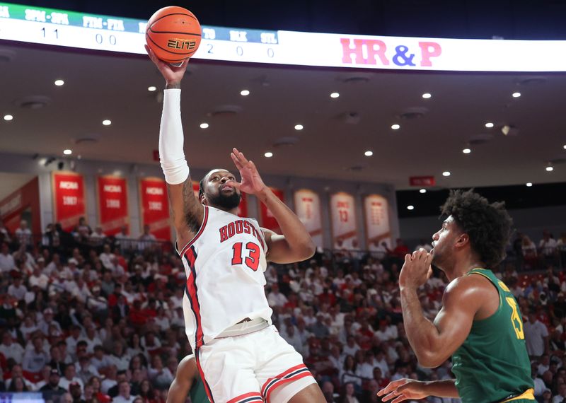 Feb 10, 2025; Houston, Texas, USA;  Houston Cougars forward J'Wan Roberts (13) shoots against Baylor Bears forward Norchad Omier (15) in the first half at Fertitta Center. Mandatory Credit: Thomas Shea-Imagn Images