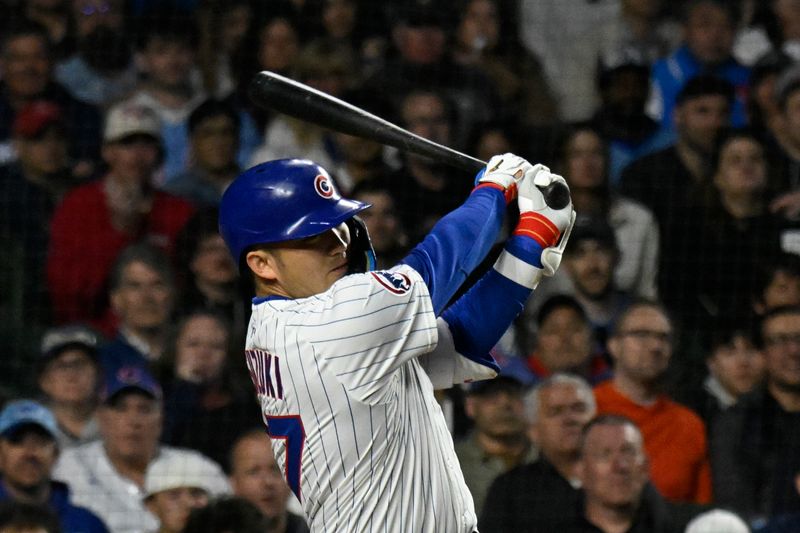 May 12, 2025; Chicago, Illinois, USA;  Chicago Cubs outfielder Seiya Suzuki (27) hits a two run home run against the Miami Marlins during the fifth inning at Wrigley Field. Mandatory Credit: Matt Marton-Imagn Images