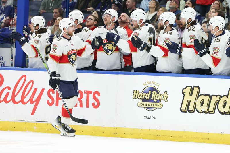 Feb 17, 2024; Tampa, Florida, USA;  Florida Panthers center Sam Bennett (9) celebrates after scoring a goal against the Tampa Bay Lightning in the first period at Amalie Arena. Mandatory Credit: Nathan Ray Seebeck-USA TODAY Sports