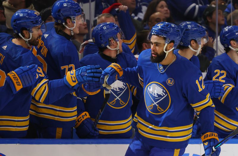 Dec 21, 2023; Buffalo, New York, USA;  Buffalo Sabres left wing Jordan Greenway (12) celebrates his goal with teammates during the first period against the Toronto Maple Leafs at KeyBank Center. Mandatory Credit: Timothy T. Ludwig-USA TODAY Sports