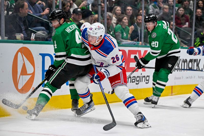 Nov 20, 2023; Dallas, Texas, USA; New York Rangers left wing Jimmy Vesey (26) checks Dallas Stars defenseman Miro Heiskanen (4) during the first period at the American Airlines Center. Mandatory Credit: Jerome Miron-USA TODAY Sports