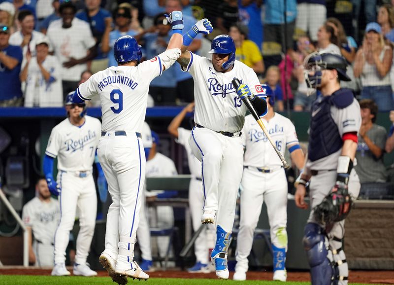 Aug 7, 2024; Kansas City, Missouri, USA; Kansas City Royals designated hitter Vinnie Pasquantino (9) celebrates with first baseman Salvador Perez (13) after hitting a home run during the fourth inning against the Boston Red Sox at Kauffman Stadium. Mandatory Credit: Jay Biggerstaff-USA TODAY Sports