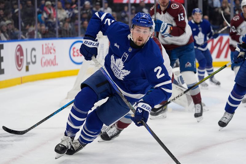 Jan 25, 2026; Toronto, Ontario, CAN; Toronto Maple Leafs defenseman Simon Benoit (2) skates against the Colorado Avalanche during the first period at Scotiabank Arena. Mandatory Credit: John E. Sokolowski-Imagn Images