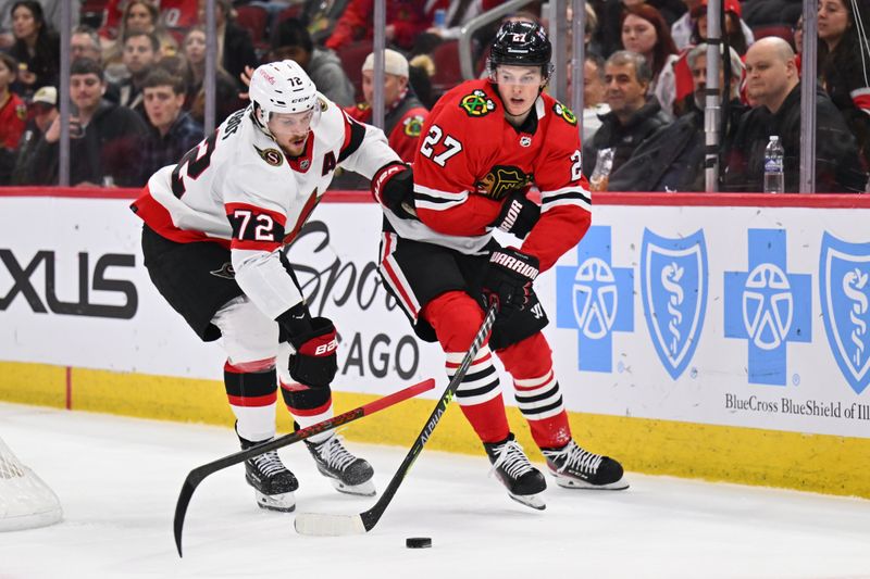 Mar 6, 2023; Chicago, Illinois, USA;  Chicago Blackhawks forward Lukas Reichel (27) passes off the puck as Ottawa Senators defenseman Thomas Chabot (72) loses his stick in the second period at United Center. Mandatory Credit: Jamie Sabau-USA TODAY Sports