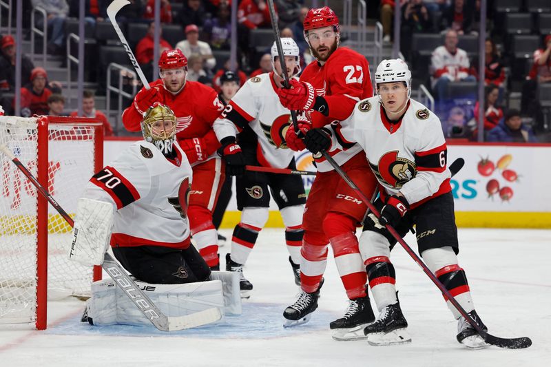 Jan 31, 2024; Detroit, Michigan, USA;  Detroit Red Wings center Michael Rasmussen (27) and Ottawa Senators defenseman Jakob Chychrun (6) fight for position in front of goaltender Joonas Korpisalo (70) in the second period at Little Caesars Arena. Mandatory Credit: Rick Osentoski-USA TODAY Sports