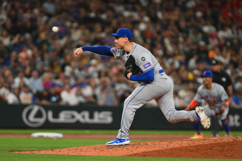 Aug 9, 2024; Seattle, Washington, USA; New York Mets relief pitcher Adam Ottavino (0) pitches to the Seattle Mariners during the seventh inning at T-Mobile Park. Mandatory Credit: Steven Bisig-USA TODAY Sports