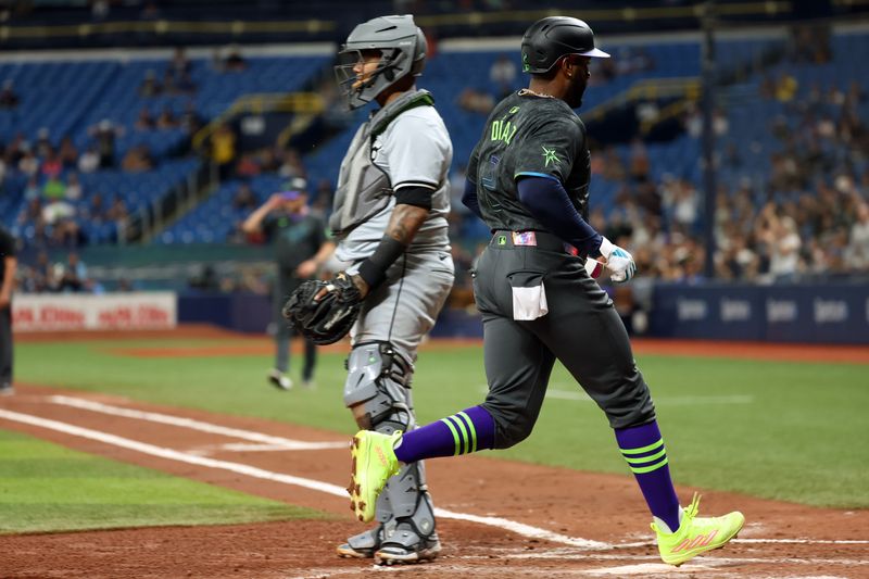May 8, 2024; St. Petersburg, Florida, USA;  Tampa Bay Rays first base Yandy Díaz (2) scores a run as Chicago White Sox catcher Martín Maldonado (15) looks on during the fourth inning at Tropicana Field. Mandatory Credit: Kim Klement Neitzel-USA TODAY Sports