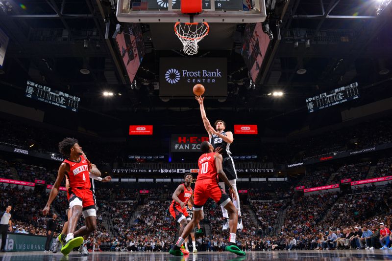 SAN ANTONIO, TX - MARCH 12: Zach Collins #23 of the San Antonio Spurs drives to the basket during the game against the Houston Rockets on March 12, 2024 at the Frost Bank Center in San Antonio, Texas. NOTE TO USER: User expressly acknowledges and agrees that, by downloading and or using this photograph, user is consenting to the terms and conditions of the Getty Images License Agreement. Mandatory Copyright Notice: Copyright 2024 NBAE (Photos by Jesse D. Garrabrant/NBAE via Getty Images)