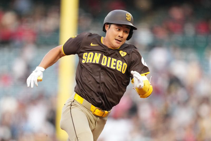 Jun 3, 2024; Anaheim, California, USA; San Diego Padres shortstop Ha-Seong Kim (7) rounds second base on a double in the second inning against the Los Angeles Angels at Angel Stadium. Mandatory Credit: Kirby Lee-USA TODAY Sports