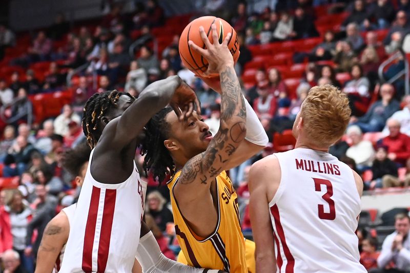 Jan 28, 2023; Pullman, Washington, USA; Arizona State Sun Devils guard Frankie Collins (10) shoots the ball against Washington State Cougars guard Jabe Mullins (3) and Washington State Cougars center Adrame Diongue (15) in the first half at Friel Court at Beasley Coliseum. Mandatory Credit: James Snook-USA TODAY Sports