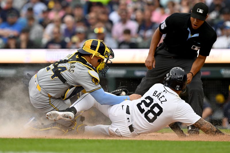 Jun 8, 2024; Detroit, Michigan, USA;  Detroit Tigers shortstop Javier Báez (28) is tagged out at the plate by Milwaukee Brewers catcher William Contreras (24) in the second inning at Comerica Park. Mandatory Credit: Lon Horwedel-USA TODAY Sports