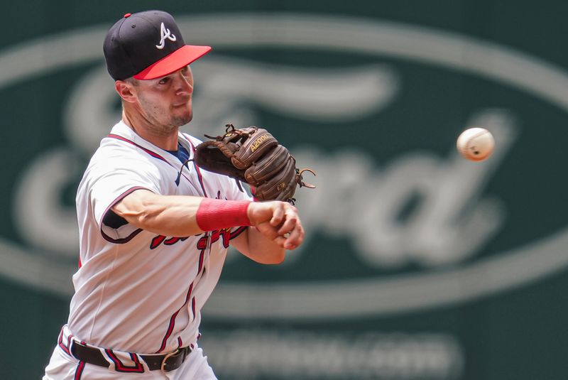 Jul 24, 2024; Cumberland, Georgia, USA; Atlanta Braves third baseman Zack Short (59) throws out Cincinnati Reds second baseman Jonathan India (6) (not pictured) during the first inning at Truist Park. Mandatory Credit: Dale Zanine-USA TODAY Sports