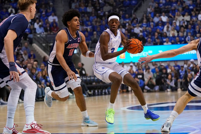Jan 26, 2026; Provo, Utah, USA; BYU Cougars forward AJ Dybantsa (3) controls the ball while being defended by Arizona Wildcats forward Koa Peat (10) during the first half  at Marriott Center. Mandatory Credit: Aaron Baker-Imagn Images 