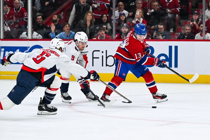 Apr 27, 2025; Montreal, Quebec, CAN; Washington Capitals defenseman Jakob Chychrun (6) and right wing Ryan Leonard (9) defend the puck against Montreal Canadiens right wing Cole Caufield (13) during the first period in game four of the first round of the 2025 Stanley Cup Playoffs at Bell Centre. Mandatory Credit: David Kirouac-Imagn Images