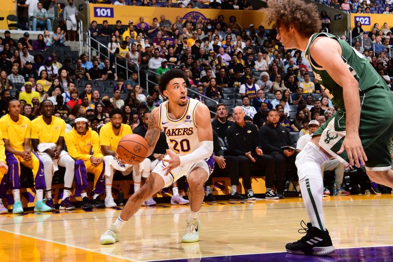 LOS ANGELES, CA - OCTOBER 15: Scotty Pippin Jr. #20 of the Los Angeles Lakers handles the ball during the game against the Milwaukee Bucks on October 15, 2023 at Crypto.Com Arena in Los Angeles, California. NOTE TO USER: User expressly acknowledges and agrees that, by downloading and/or using this Photograph, user is consenting to the terms and conditions of the Getty Images License Agreement. Mandatory Copyright Notice: Copyright 2023 NBAE (Photo by Adam Pantozzi/NBAE via Getty Images)