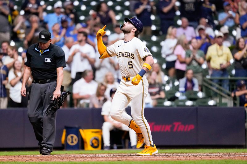 Sep 19, 2024; Milwaukee, Wisconsin, USA;  Milwaukee Brewers designated hitter Garrett Mitchell (5) celebrates after hitting a home run during the seventh inning against the Arizona Diamondbacks at American Family Field. Mandatory Credit: Jeff Hanisch-Imagn Images