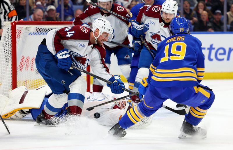 Dec 3, 2024; Buffalo, New York, USA;  Colorado Avalanche goaltender Scott Wedgewood (41) makes a save as Buffalo Sabres center Peyton Krebs (19) and Colorado Avalanche defenseman Calvin de Haan (44) go after a rebound at KeyBank Center. Mandatory Credit: Timothy T. Ludwig-Imagn Images