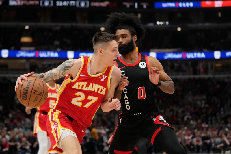 CHICAGO, ILLINOIS - APRIL 01: Vit Krejci #27 of the Atlanta Hawks dribbles the ball against Coby White #0 of the Chicago Bulls during the first half at the United Center on April 01, 2024 in Chicago, Illinois. NOTE TO USER: User expressly acknowledges and agrees that, by downloading and or using this photograph, User is consenting to the terms and conditions of the Getty Images License Agreement. (Photo by Patrick McDermott/Getty Images)