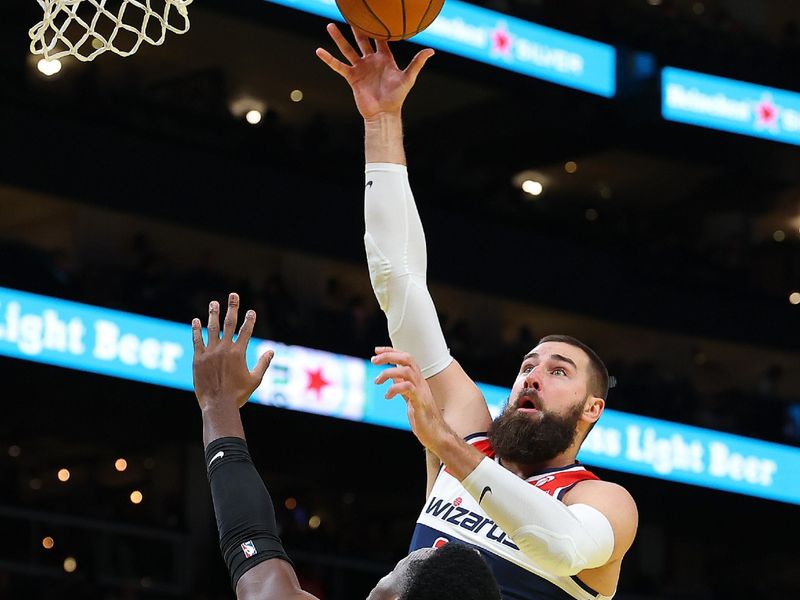 ATLANTA, GEORGIA - NOVEMBER 15:  Jonas Valanciunas #17 of the Washington Wizards attempts a shot against Onyeka Okongwu #17 of the Atlanta Hawks during the first quarter of the Emirates NBA Cup game at State Farm Arena on November 15, 2024 in Atlanta, Georgia.  NOTE TO USER: User expressly acknowledges and agrees that, by downloading and/or using this photograph, user is consenting to the terms and conditions of the Getty Images License Agreement.  (Photo by Kevin C. Cox/Getty Images)