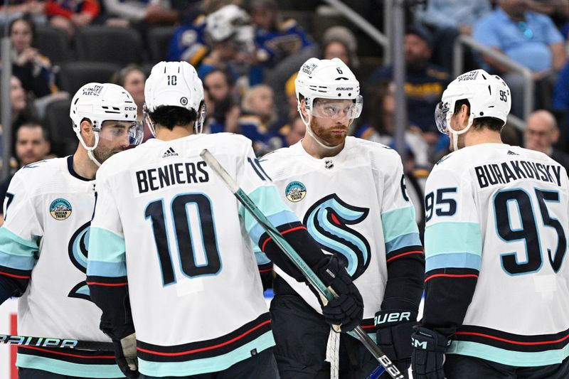 Apr 14, 2024; St. Louis, Missouri, USA; Seattle Kraken defenseman Adam Larsson (6) looks on with center Matty Beniers (10) and left wing Andre Burakovsky (95) during the thrid period of a hockey game against the St. Louis Blues at Enterprise Center. Mandatory Credit: Jeff Le-USA TODAY Sports