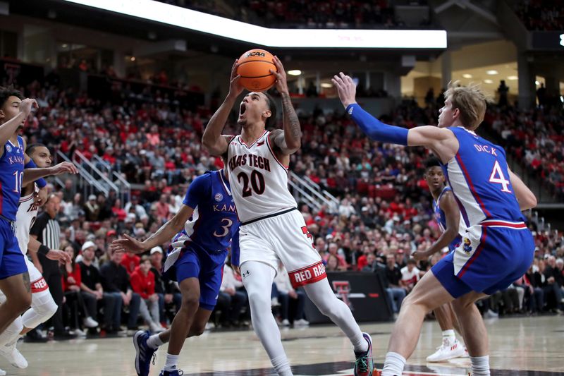 Jan 3, 2023; Lubbock, Texas, USA;  Texas Tech Red Raiders guard Jaylon Tyson (20) goes to the basket against Kansas Jayhawks guard Gradey Dick (4) and guard Dajuan Harris Jr (3) in the first half at United Supermarkets Arena. Mandatory Credit: Michael C. Johnson-USA TODAY Sports