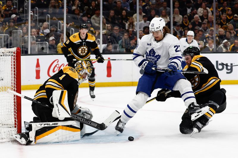 Oct 26, 2024; Boston, Massachusetts, USA; Toronto Maple Leafs left wing Matthew Knies (23) battles for a rebound in front of Boston Bruins goaltender Jeremy Swayman (1) during the second period at TD Garden. Mandatory Credit: Winslow Townson-Imagn Images