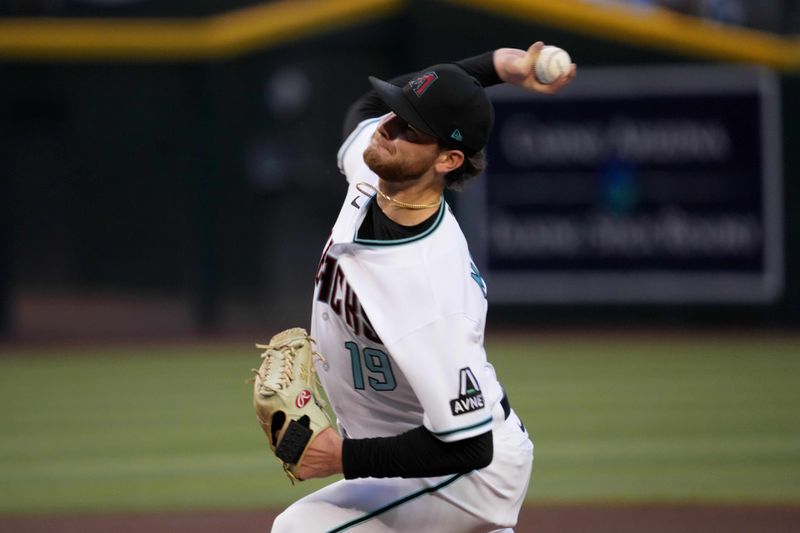 Apr 25, 2023; Phoenix, Arizona, USA; Arizona Diamondbacks starting pitcher Ryne Nelson (19) pitches against the Kansas City Royals during the first inning at Chase Field. Mandatory Credit: Joe Camporeale-USA TODAY Sports