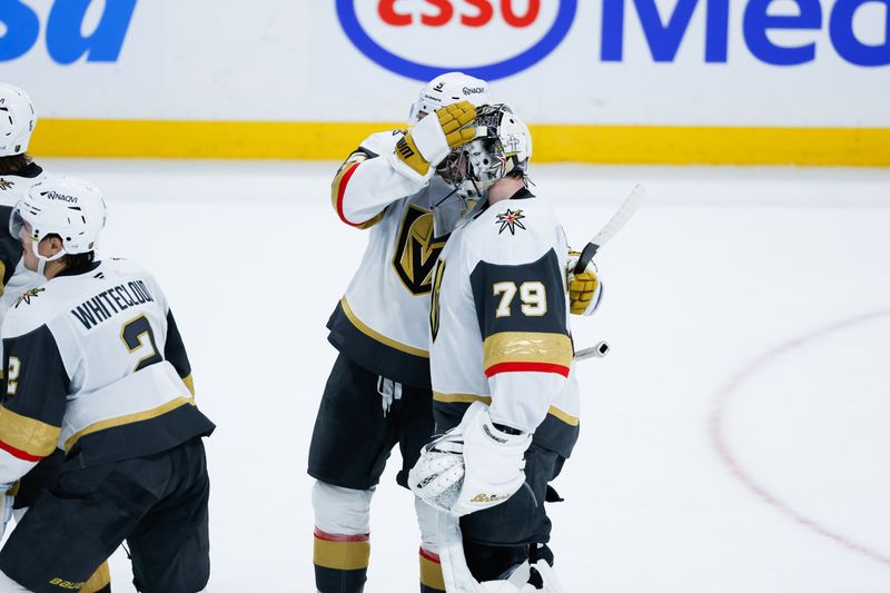 Jan 6, 2026; Winnipeg, Manitoba, CAN; Vegas Golden Knights goalie Carter Hart (79) is congratulated by Vegas Golden Knights defenseman Jeremy Lauzon (5) on his win against the Winnipeg Jets during the overtime period at Canada Life Centre. Mandatory Credit: Terrence Lee-Imagn Images