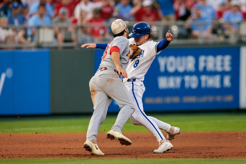 May 17, 2025; Kansas City, Missouri, USA; St. Louis Cardinals third base Nolan Arenado (28) tags Kansas City Royals outfielder Drew Waters (8) during the eighth inning at Kauffman Stadium. Mandatory Credit: William Purnell-Imagn Images