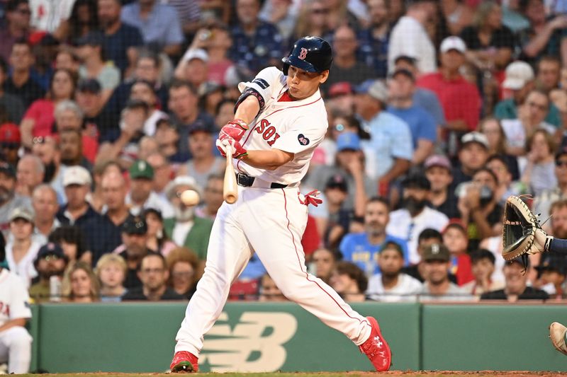 Jul 30, 2024; Boston, Massachusetts, USA; Boston Red Sox designated hitter Masataka Yoshida (7) hits a single against the Seattle Mariners during the third inning at Fenway Park. Mandatory Credit: Eric Canha-USA TODAY Sports