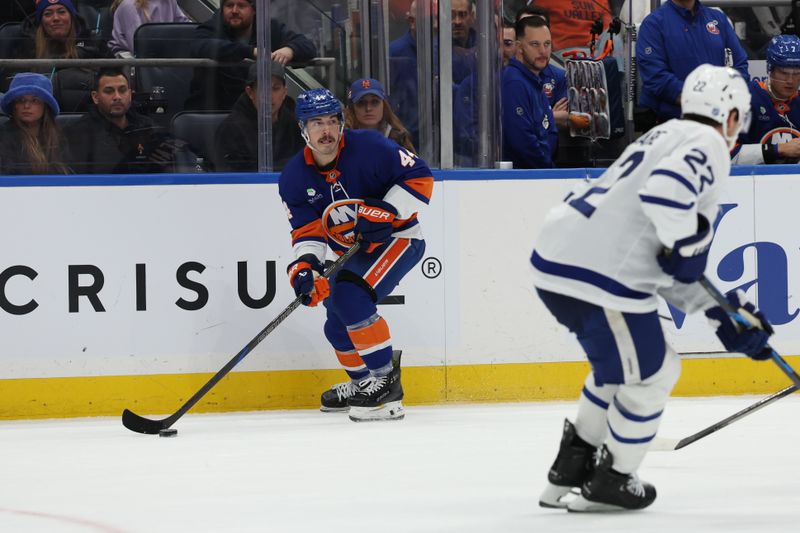 Jan 3, 2026; Elmont, New York, USA; New York Islanders center Jean-Gabriel Pageau (44) looks to make a pass Toronto Maple Leafs during the second period at UBS Arena. Mandatory Credit: Thomas Salus-Imagn Images