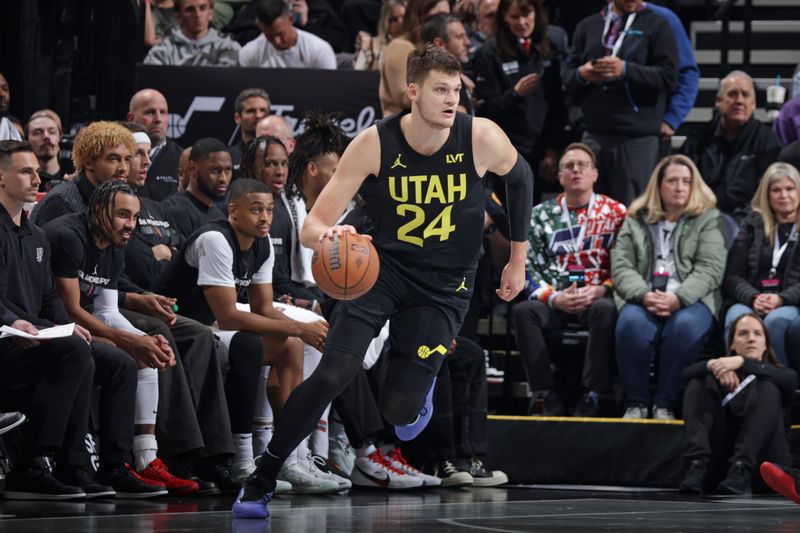 SALT LAKE CITY, UT - NOVEMBER 26: Walker Kessler #24 of the Utah Jazz dribbles the ball during the game against the San Antonio Spurs during the Emirates NBA Cup game on November 26, 2024 at Delta Center in Salt Lake City, Utah. NOTE TO USER: User expressly acknowledges and agrees that, by downloading and or using this Photograph, User is consenting to the terms and conditions of the Getty Images License Agreement. Mandatory Copyright Notice: Copyright 2024 NBAE (Photo by Melissa Majchrzak/NBAE via Getty Images)