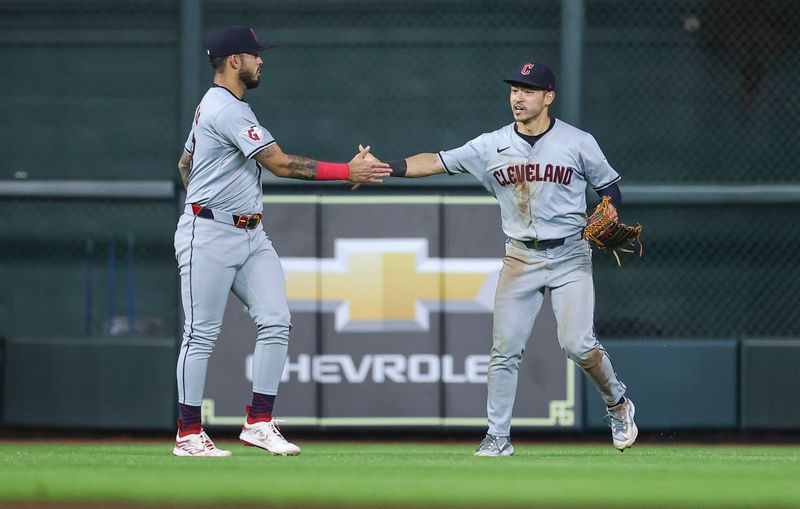 May 1, 2024; Houston, Texas, USA;  Cleveland Guardians left fielder Steven Kwan (38) celebrates with Gabriel Arias (13) after a double play to end the game during the tenth inning against the Houston Astros at Minute Maid Park. Mandatory Credit: Troy Taormina-USA TODAY Sports