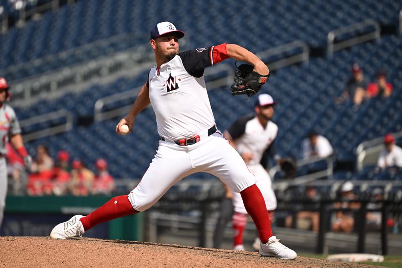 Jul 7, 2024; Washington, District of Columbia, USA; Washington Nationals relief pitcher Tanner Rainey (21).throws a pitch against the St. Louis Cardinals during the ninth inning at Nationals Park. Mandatory Credit: Rafael Suanes-USA TODAY Sports