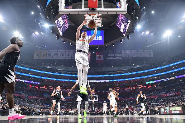 LOS ANGELES, CA - DECEMBER 6: Christian Braun #0 of the Denver Nuggets goes to the basket during the game on December 6, 2023 at Crypto.Com Arena in Los Angeles, California. NOTE TO USER: User expressly acknowledges and agrees that, by downloading and/or using this Photograph, user is consenting to the terms and conditions of the Getty Images License Agreement. Mandatory Copyright Notice: Copyright 2023 NBAE (Photo by Adam Pantozzi/NBAE via Getty Images)