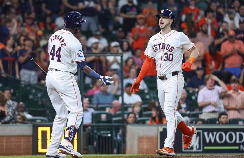 May 21, 2024; Houston, Texas, USA; Houston Astros right fielder Kyle Tucker (30) celebrates with designated hitter Yordan Alvarez (44) after hitting a home run during the first inning against the Los Angeles Angels at Minute Maid Park. Mandatory Credit: Troy Taormina-USA TODAY Sports