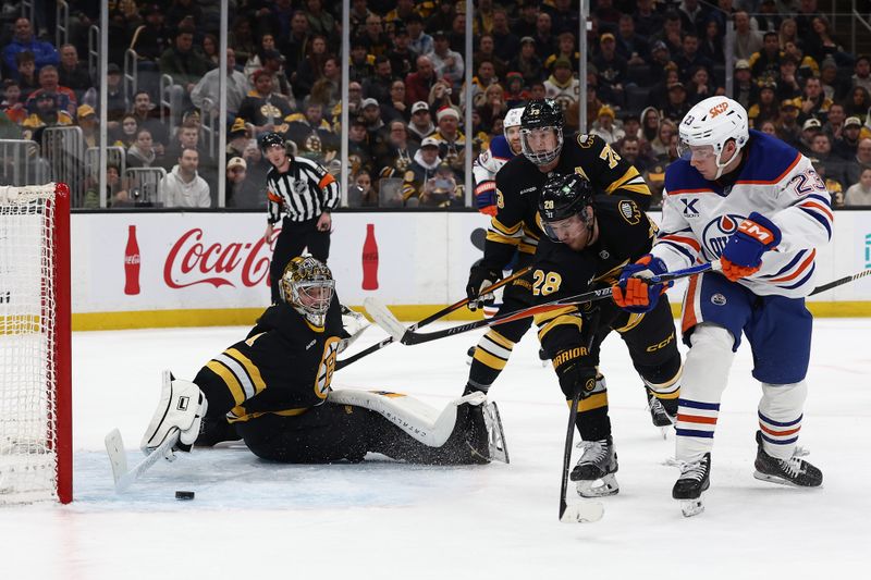 Dec 18, 2025; Boston, Massachusetts, USA; Edmonton Oilers right wing Quinn Hutson (23) scores his first NHL goal on Boston Bruins goaltender Jeremy Swayman (1) during the second period at TD Garden. Mandatory Credit: Winslow Townson-Imagn Images