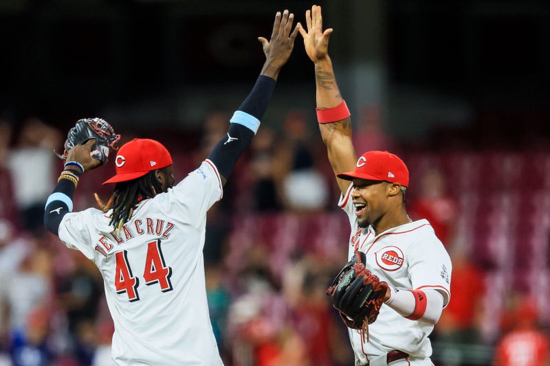 Aug 12, 2024; Cincinnati, Ohio, USA; Cincinnati Reds outfielder Will Benson (30) high fives shortstop Elly De La Cruz (44) after the victory over the St. Louis Cardinals at Great American Ball Park. Mandatory Credit: Katie Stratman-USA TODAY Sports