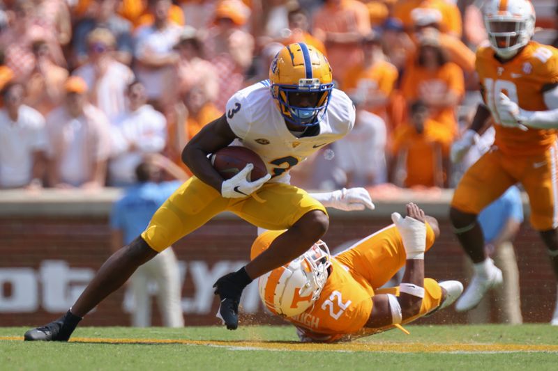 Sep 11, 2021; Knoxville, Tennessee, USA; Pittsburgh Panthers wide receiver Jordan Addison (3) runs the ball against Tennessee Volunteers defensive back Jaylen McCollough (22) during the second half at Neyland Stadium. Mandatory Credit: Randy Sartin-USA TODAY Sports