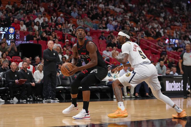 MIAMI, FL - MARCH 13: Jimmy Butler #22 of the Miami Heat handles the ball during the game against the Denver Nuggets on March 13, 2024 at Kaseya Center in Miami, Florida. NOTE TO USER: User expressly acknowledges and agrees that, by downloading and or using this Photograph, user is consenting to the terms and conditions of the Getty Images License Agreement. Mandatory Copyright Notice: Copyright 2024 NBAE (Photo by Eric Espada/NBAE via Getty Images)