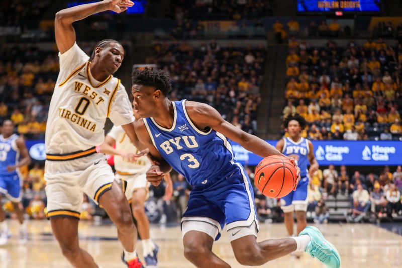 Feb 28, 2026; Morgantown, West Virginia, USA; BYU Cougars forward AJ Dybantsa (3) drives baseline against West Virginia Mountaineers forward Brenen Lorient (0) during the first half at Hope Coliseum. Mandatory Credit: Ben Queen-Imagn Images