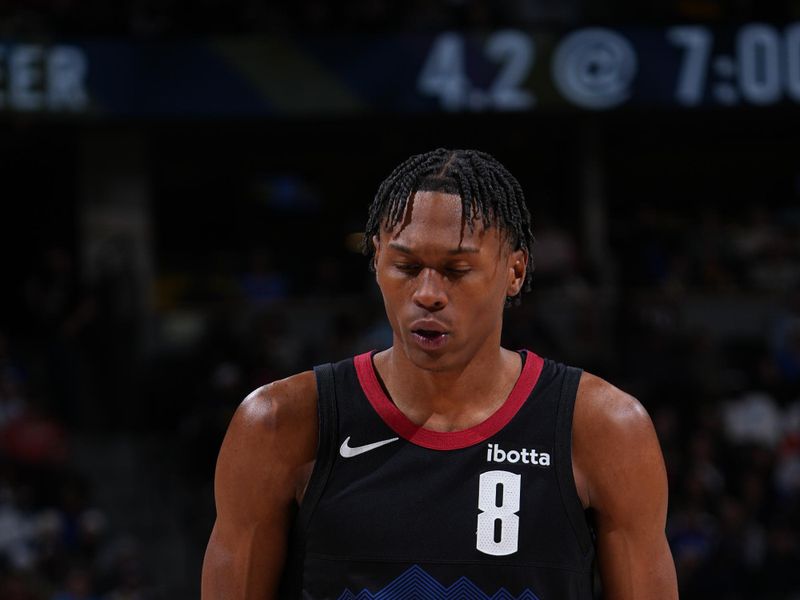 DENVER, CO - JANUARY 7: Peyton Watson #8 of the Denver Nuggets shoots a free throw during the game against the Detroit Pistons on January 7, 2024 at the Ball Arena in Denver, Colorado. NOTE TO USER: User expressly acknowledges and agrees that, by downloading and/or using this Photograph, user is consenting to the terms and conditions of the Getty Images License Agreement. Mandatory Copyright Notice: Copyright 2024 NBAE (Photo by Garrett Ellwood/NBAE via Getty Images)