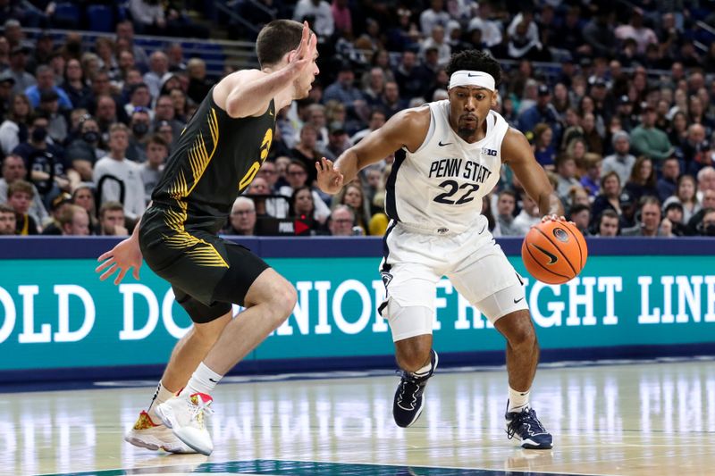 Jan 1, 2023; University Park, Pennsylvania, USA; Penn State Nittany Lions guard Jalen Pickett (22) looks to dribble the ball around Iowa Hawkeyes forward Filip Rebraca (0) during the first half at Bryce Jordan Center. Mandatory Credit: Matthew OHaren-USA TODAY Sports