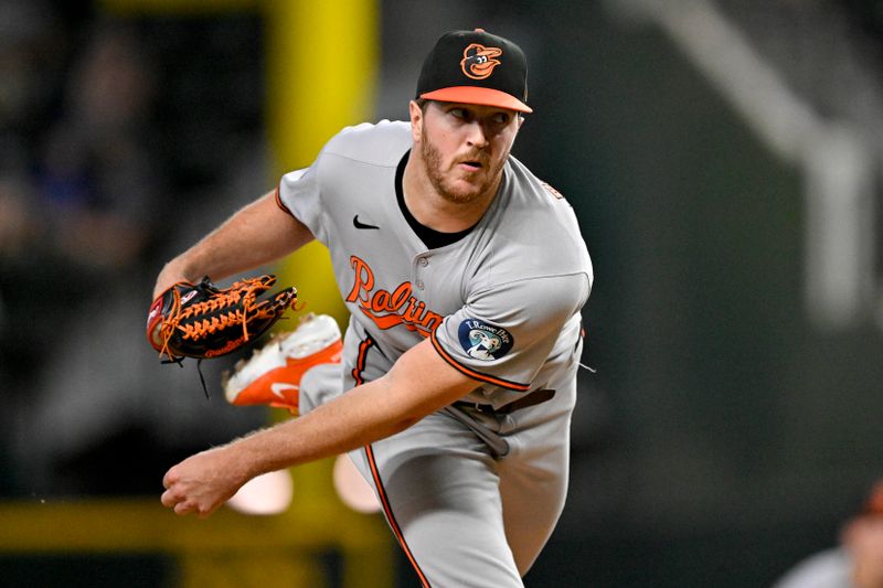 Jun 30, 2025; Arlington, Texas, USA; Baltimore Orioles starting pitcher Trevor Rogers (28) pitches against the Texas Rangers during the first inning at Globe Life Field. Mandatory Credit: Jerome Miron-Imagn Images