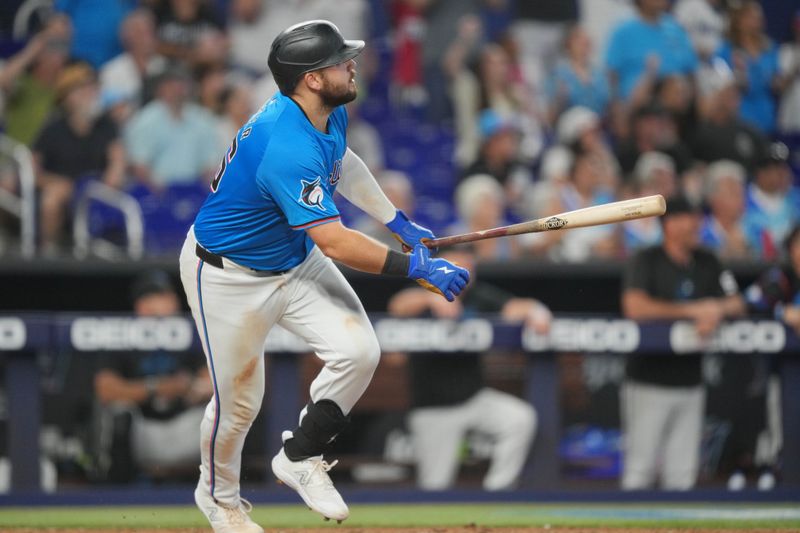 Jul 7, 2024; Miami, Florida, USA;  Miami Marlins third baseman Jake Burger (36) hits a three-run walk-off home run in the ninth inning against the Chicago White Sox at loanDepot Park. Mandatory Credit: Jim Rassol-USA TODAY Sports