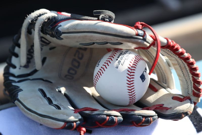 Oct 9, 2023; Los Angeles, California, USA; An official baseball in a baseball glove before game two of the NLDS between the Los Angeles Dodgers and the Arizona Diamondbacks for the 2023 MLB playoffs at Dodger Stadium. Mandatory Credit: Kiyoshi Mio-USA TODAY Sports